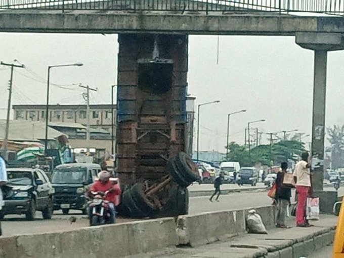 SHOCK AS TRUCK STUCK UNDER LAGOS BRIDGE